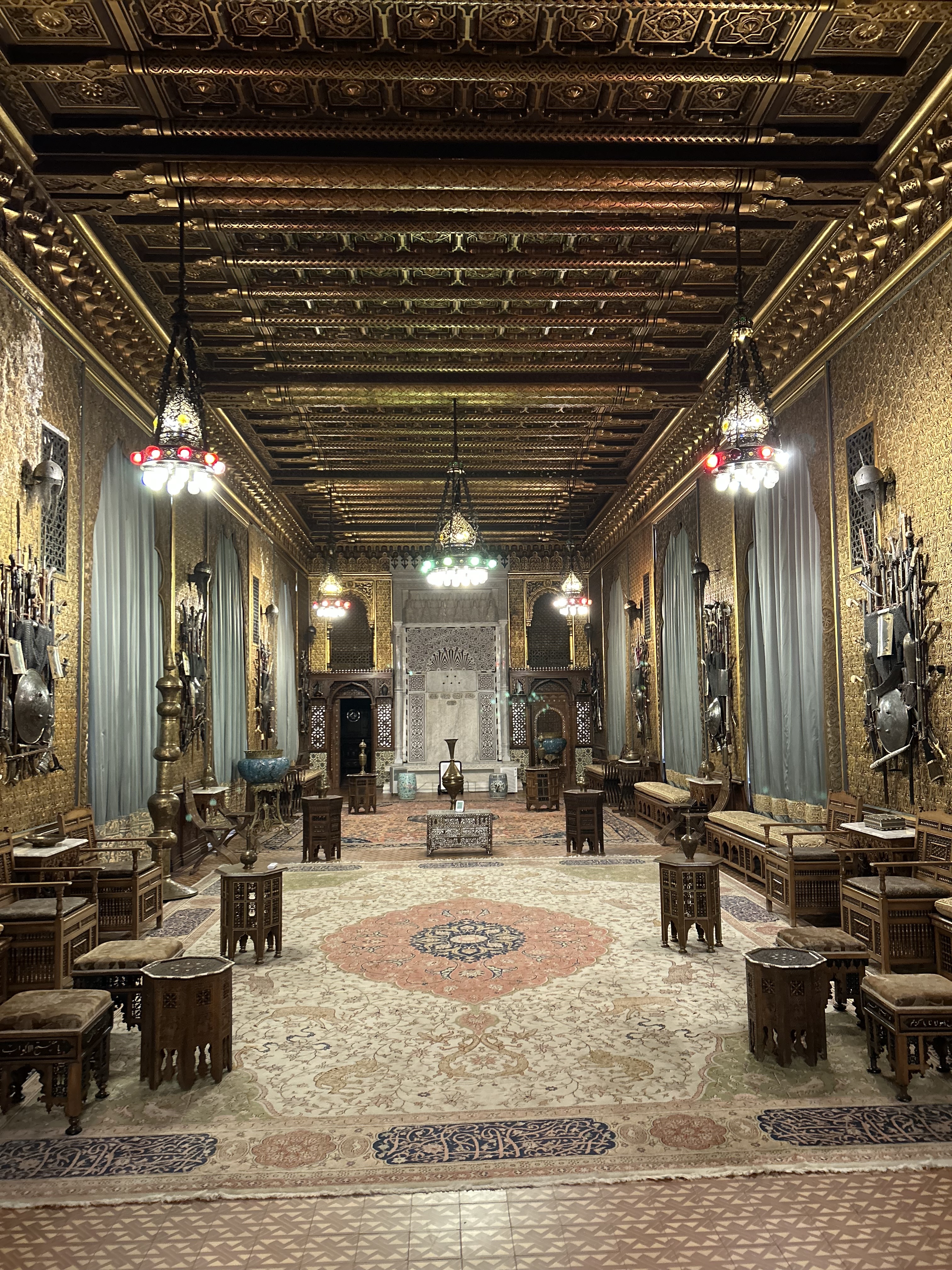 An ornate historic interior with patterned stonework and arches, photographed by Robert Wallace